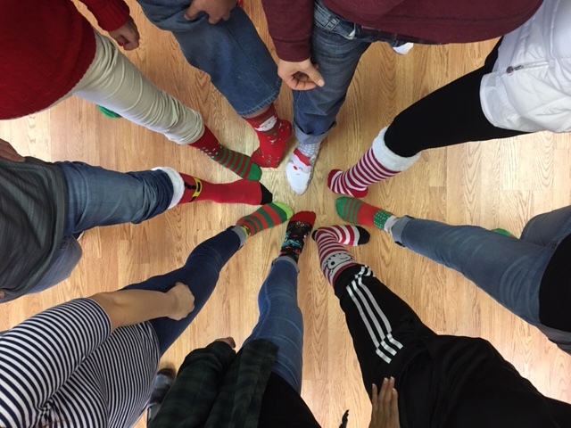 Magnolia PT Staff celebrates the holidays donning their Christmas Socks to work.